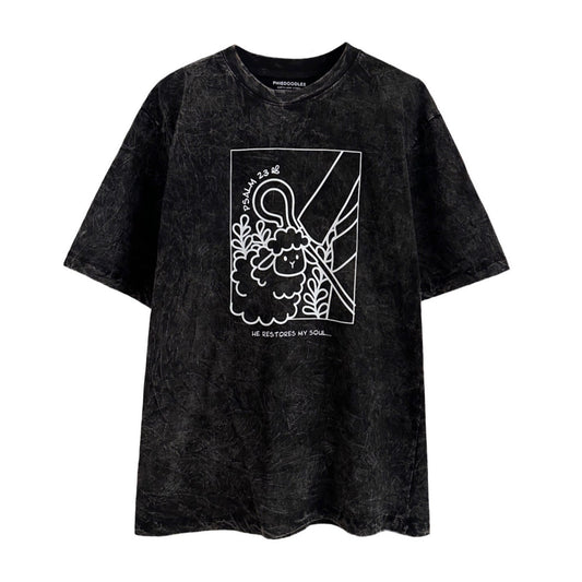 oversize t-shirt in stone wash color with a print of a sheep following the shepherd 